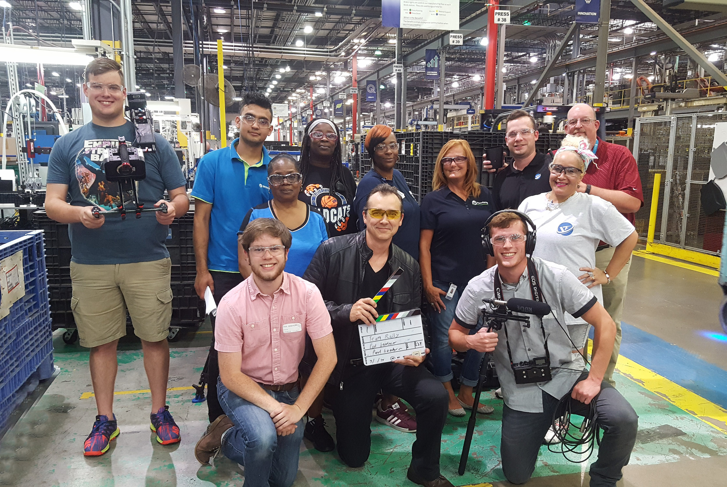 Paul Goodyear with a production team on a factory floor